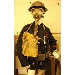 A WWII Auxillary Fire Service-Portsmouth fireman's coat, helmet, gas mask, belt and fireman's axe,