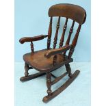 A child's beech and elm rocking chair.