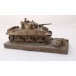 A bronze-patinated resin desk model of a Sherman M4A3 Tank, 24cm long