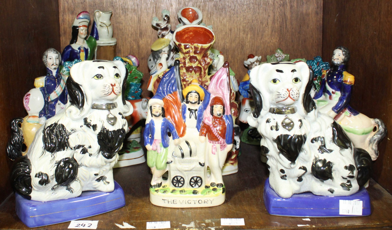 SECTION 49. A collection of twelve reproduction Staffordshire figures, comprising of a pair of