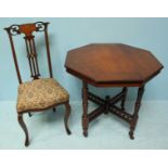 An Edwardian walnut octagonal occasional table, raised on turned supports to castors, together