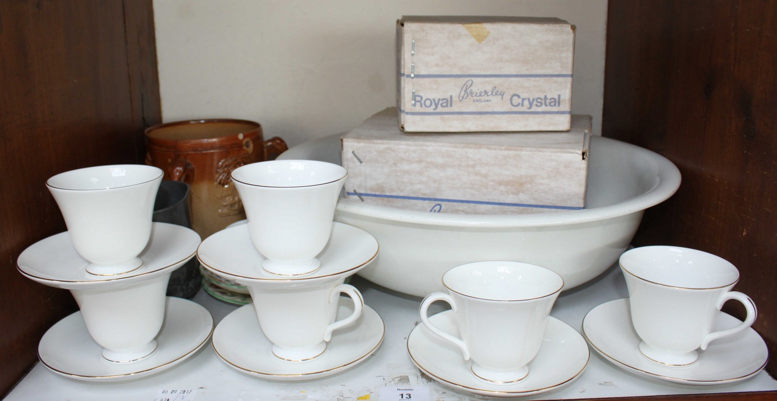 SECTION 27. A Western railways wash basin and a set of six white and gilt cups and saucers by