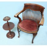 An early 20th century oak armchair, with stick back, rouge fabric upholstered seat and brass studded