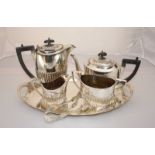 A four piece silver-plated tea set on pierced silver-plated tray, together with a pair of silver