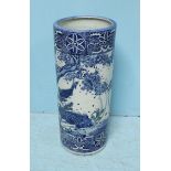 A pottery vase/stick stand of cylindrical form, decorated with a blue and white oriental design