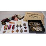 Eight various WW2 Medals and Campaign Stars, together a collection of cap badges, cloth badges and