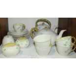 SECTION 25. A twenty-two piece Belleek porcelain tea-set comprising of two teapots, cups, saucers