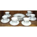 SECTION 55. A six-place cabinet tea set of cup, saucer and side plate, printed in monochrome with