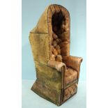 A 19th brown deep-button leather upholstered porter's chair, with tall domed back and brass