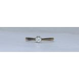 An 18ct and platinum solitaire diamond ring, eight platinum claw-set with a RBC diamond estimated