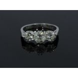 An 18ct white gold and three-stone diamond ring, claw-set RBC diamonds, estimated total diamond