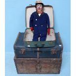 A collection of 1950s professional magician's props including a ventriloquist's doll, in two cases