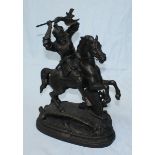 A cast iron figure of a warrior on horseback, possibly a Saxon. 51cm high.