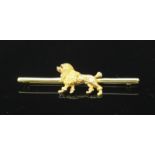 A yellow metal (tests as 18ct gold) bar brooch, modelled as a poodle. Gross weight approximately 5.