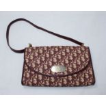 Christian Dior 'Trotter' pattern burgundy fabric and leather shoulder bag together with a matching