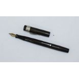 A Mabie Todd 'Blackbird' thin self filler pen with silver clip made by 'De La Rue Ltd', hallmarked