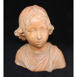 A Goldscheider style terracotta bust of a young boy. 32cm high.