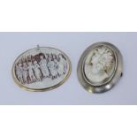 An oval shell-carved cameo brooch/pendant in 9ct gold frame, carved with dancing maidens, 6cm,