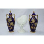 A pair of Grainger & Co porcelain vases and covers, of ovoid form with gilt tooled sunflower