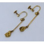 A pair of 9ct gold pendant bar earrings with screw fastenings, each suspended with a gold nugget,