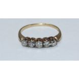 An 18ct gold and five stone diamond ring, total diamond weight approximately 0.5cts. Gross weight of