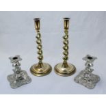 A pair of silver-plated candlesticks, 13cm high, together with a pair of brass barley-twist