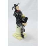 An early Royal Doulton ceramic figure, 'A Jester' 'HN.45' designed by Charles Noke, painted in