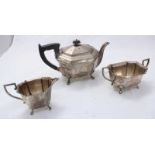 A three piece silver tea set by 'Cheltenham and Co.' including a teapot, sugar pot and a jug etc.