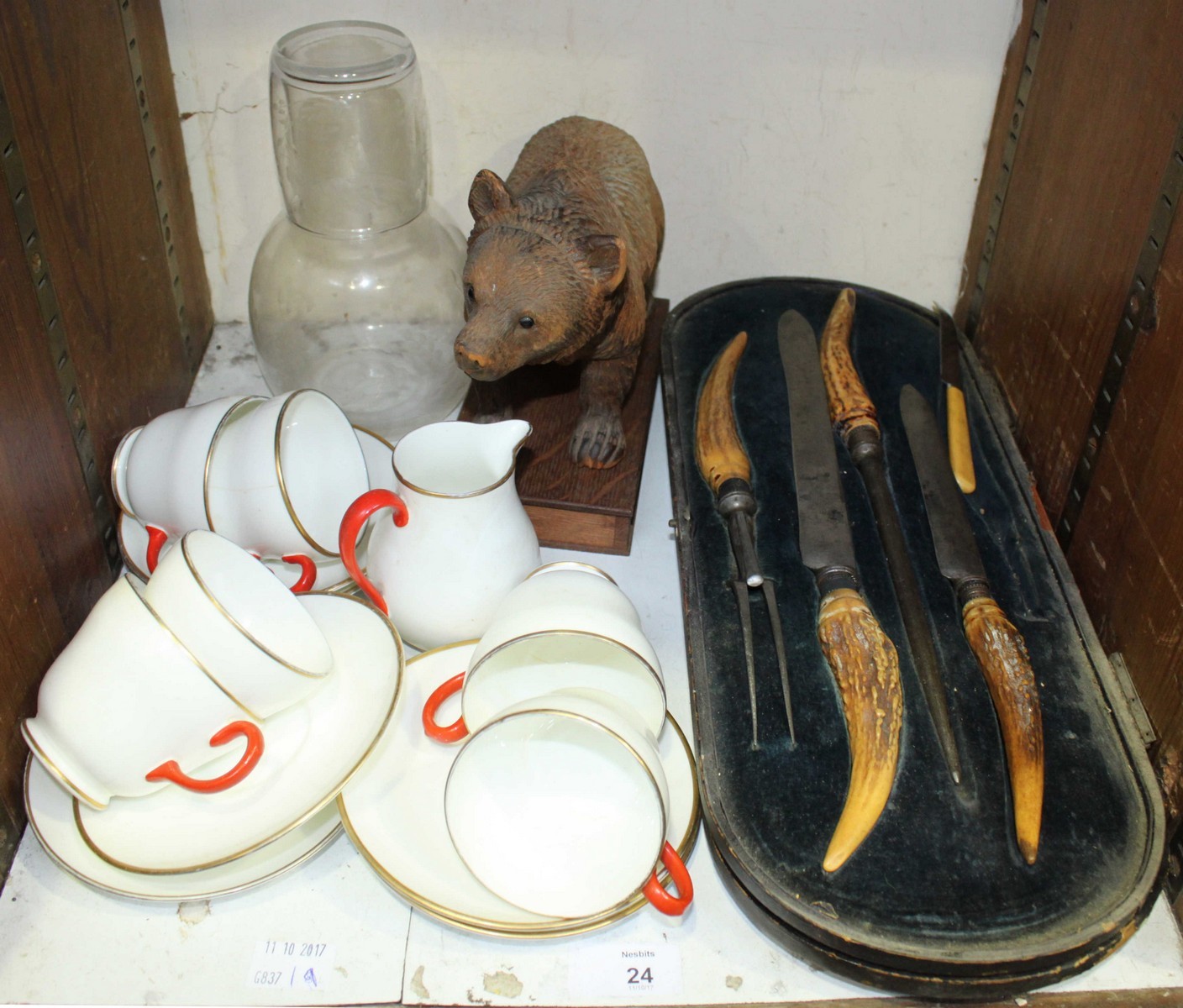 SECTION 24. A Black Forest carved wooden bear, together with a Wedgwood part tea set, glass water