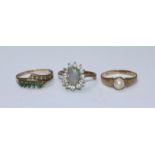 Three various 9ct gold rings including one centrally set with an opal and another with a single