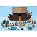 A mahogany Continental Noah's Ark with Noah, Naamah and twenty one pairs of ceramic animals