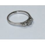 An 18ct white gold three-stone diamond ring, total diamond weight approximately 0.45ct. Gross weight