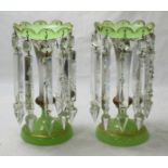 A pair of green and gilt glass prism lustres with three spare pendants, approximately 30cm high