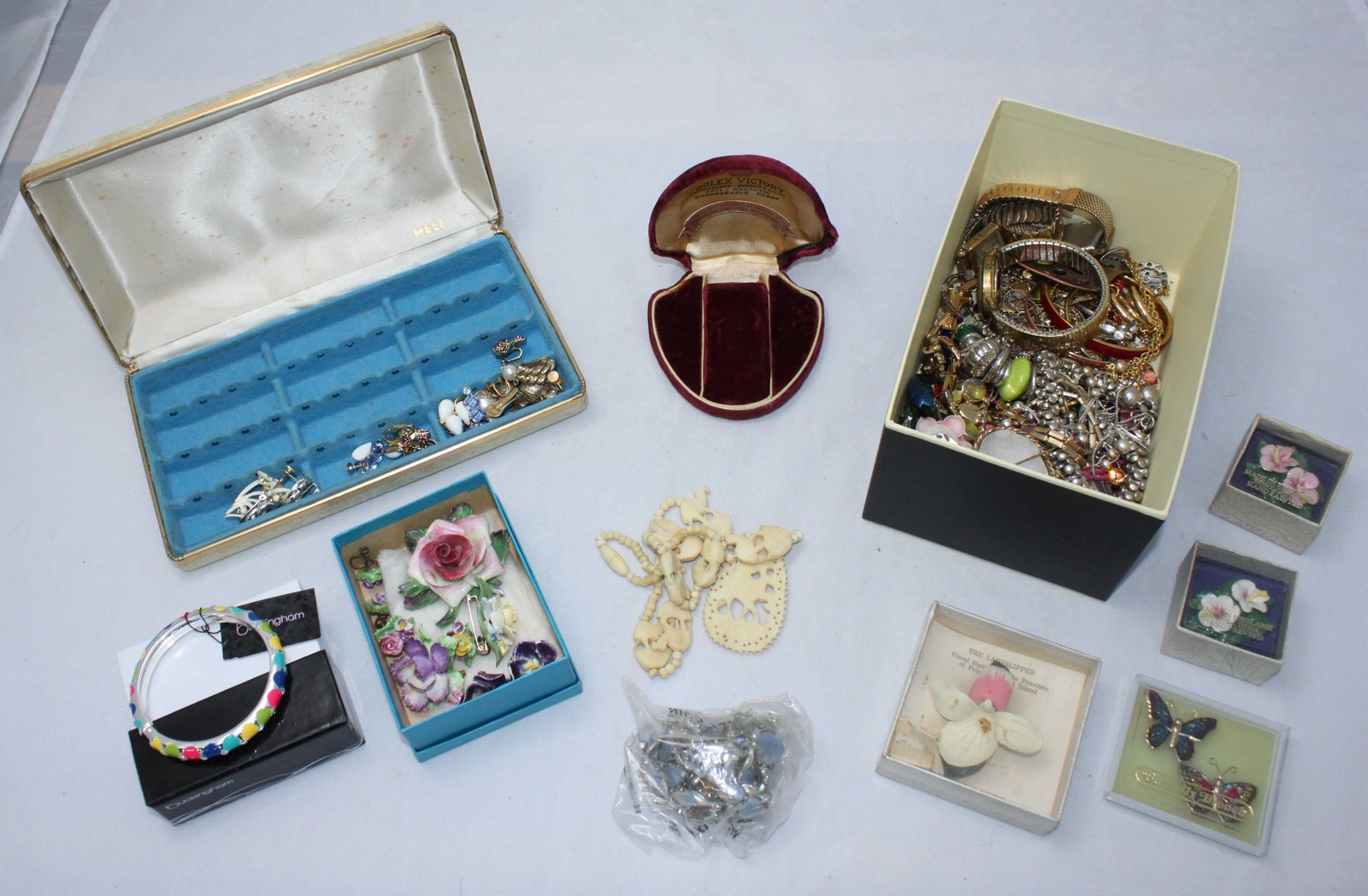 A quantity of costume jewellery including Coalbrook, watches and an early Rolex red velvet box