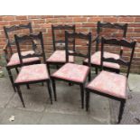 A set of eight Victorian carved stained oak dining chairs including two carvers and six standard