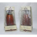 Two bottles of Bells Extra Special 2000 Millennium Whisky, in original decanters and packaging