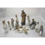 SECTION 24. A Lladro ceramic nativity scene comprising twelve various figures, (one donkey's tail is