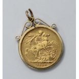 An 1884 22 carat gold full sovereign, in 9ct gold mount. Gross weight approximately 9.6g.