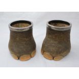 A pair of late 19th/ early 20th Century silver-mounted Indian Elephant feet pots, with marks for