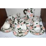 SECTION 8. A Villeroy and Boch 'Wild Rose' tea service comprising eight-each cups and saucers,