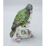 A mid-18th century soft paste porcelain model of a parrot on Rococo base, polychrome enamels, no