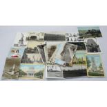 A small collection of loose postcards, predominantly of topographical interest depicting various