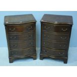 A pair of reproduction stained mahogany small serpentine chests of drawers, 50cm wide.