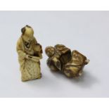 A Japanese Meiji Period Carved Ivory Okimono figure of a farmer holding a cup and a fan, 47mm