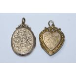 Two 9ct gold lockets with carved scrolling and floral decoration, gross weight approximately 7.0g