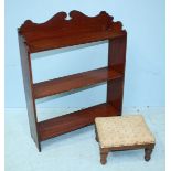 A stained wood set of three open hanging shelves, together with a fabric upholstered footstool.