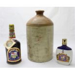 A British Navy Pusser's Rum in 75cl glass bottle, together with a 200ml pottery bottle (both sealed)