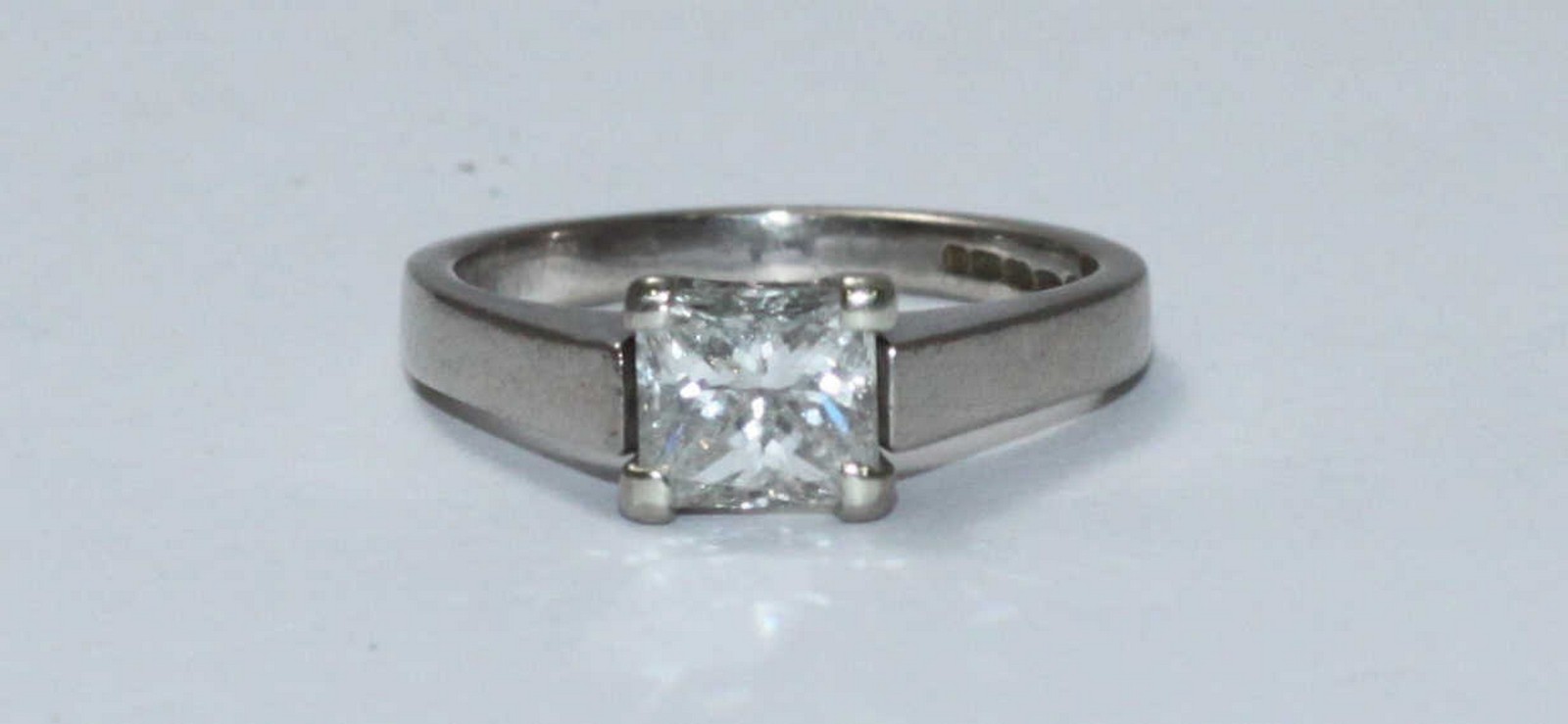 An 18ct white solitaire diamond gold ring, centrally four claw set with a princess cut diamond, - Image 2 of 2