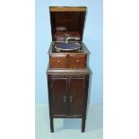 An oak cased gramophone with cabinet beneath