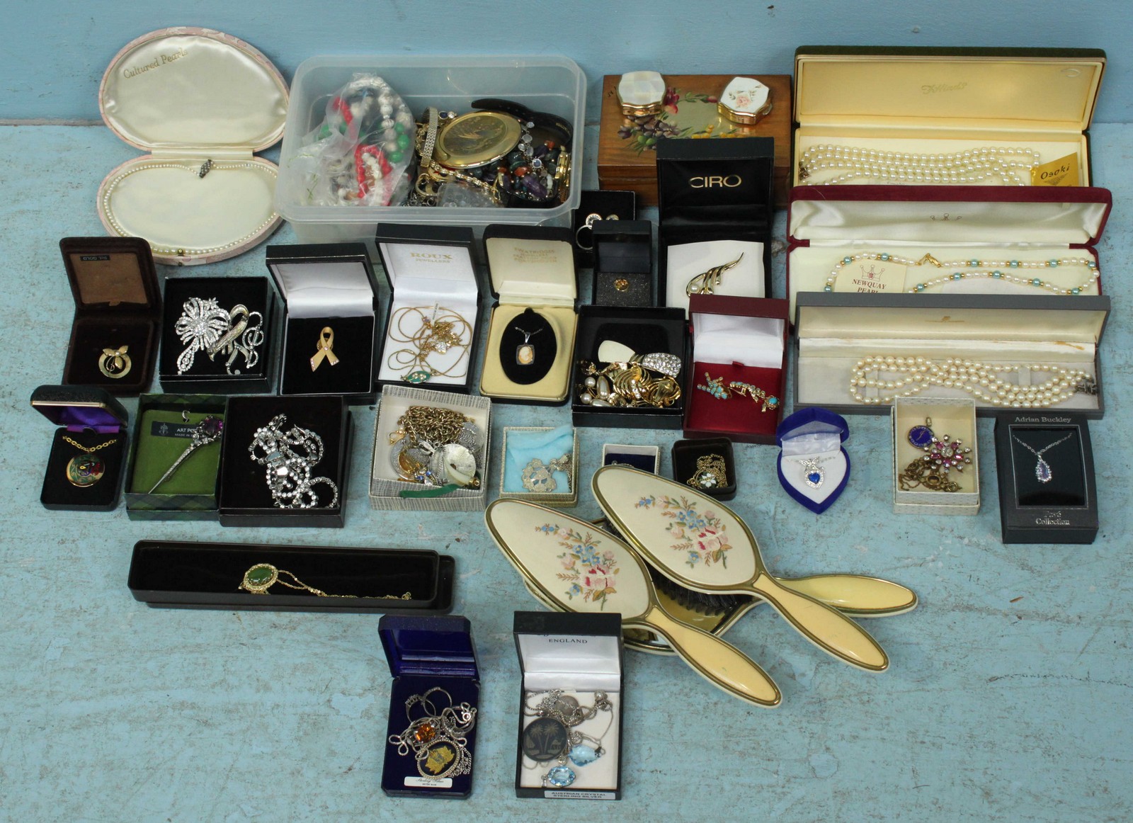 A quantity of costume jewellery including many boxed items, four simulated pearl necklaces and